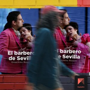 A man in a blue suit and red baseball cap walks quickly past The Barber of Seville posters.